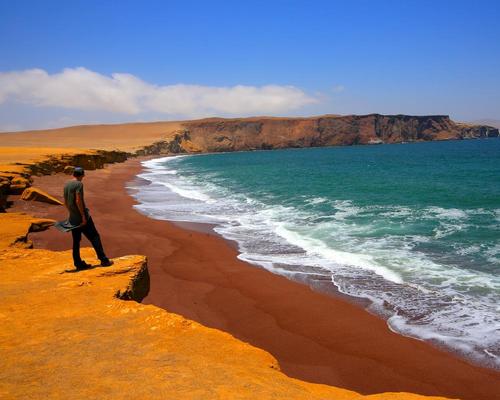 Areas of interest include the desert’s giant sand dunes and the red beaches tinted by igneous rock
