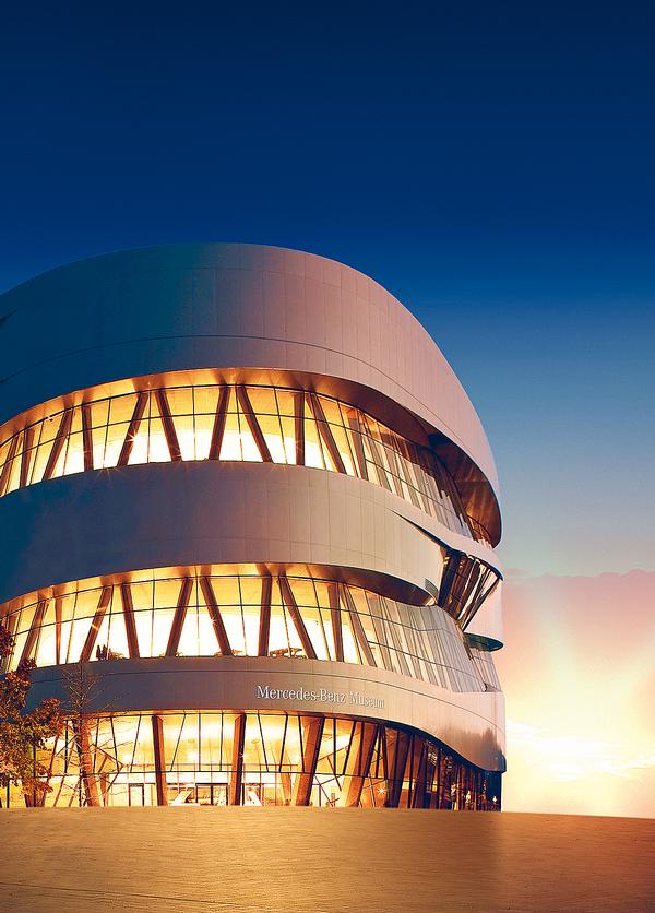 The curved Mercedes-Benz Museum in Stuttgart is located on an artificial hill