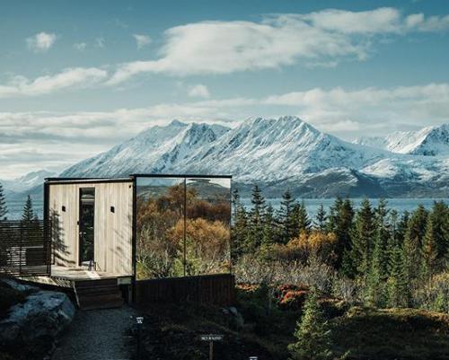 The Estonian-style saunas with reflective glass exteriors make a design statement