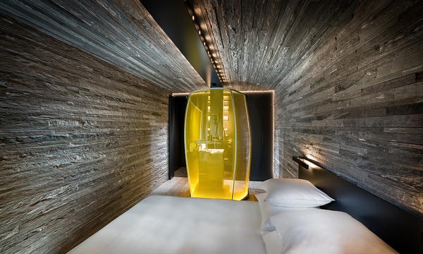 Bedrooms feature illuminated showers made by Cricursa from hot-bent glass. They’re ‘objects of desire, which animate the rooms’ says Mayne