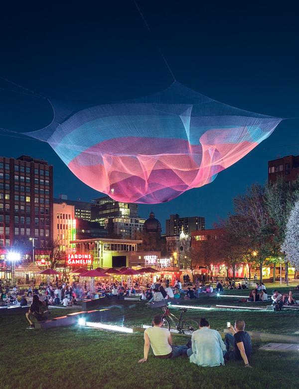 The open air bar/event space Jardins Gamelin features an illuminated suspended sculpture 
