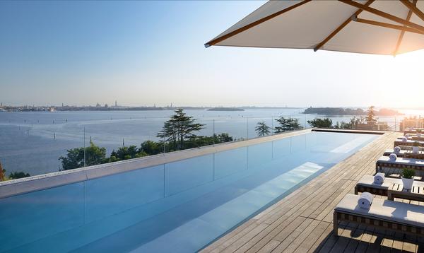 The outdoor pool deck offers views across to Venice 