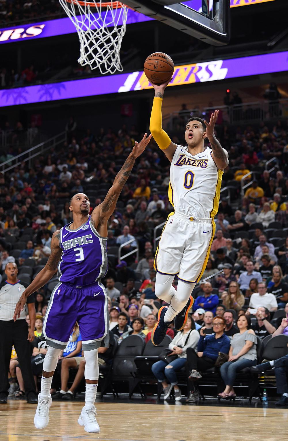 Los Angeles Lakers forward Kyle Kuzma shoots the ball against Sacramento Kings guard George Hill / © USA TODAY Sports/SIPA USA/PA Images